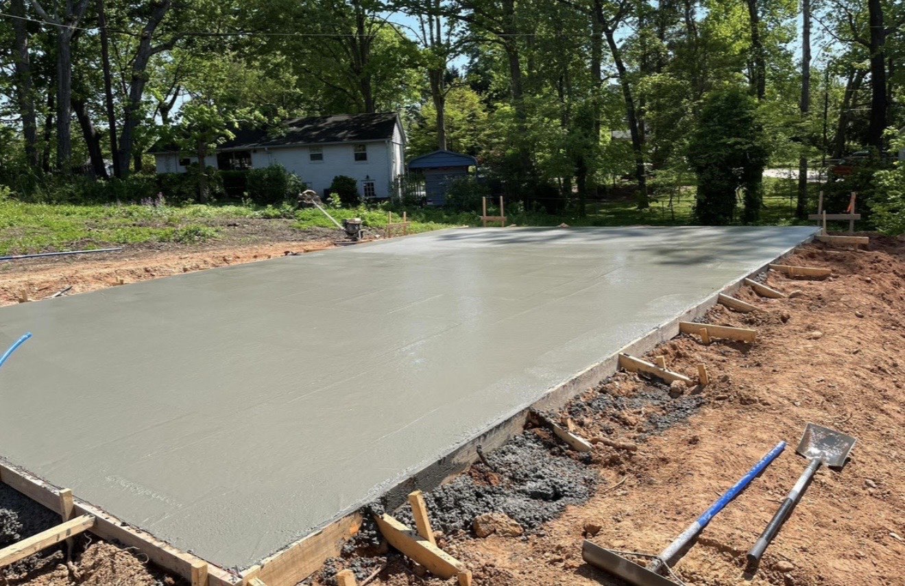 Floating the Surface Flat — step 11 of a Local Driveway Co project in Charlotte, NC